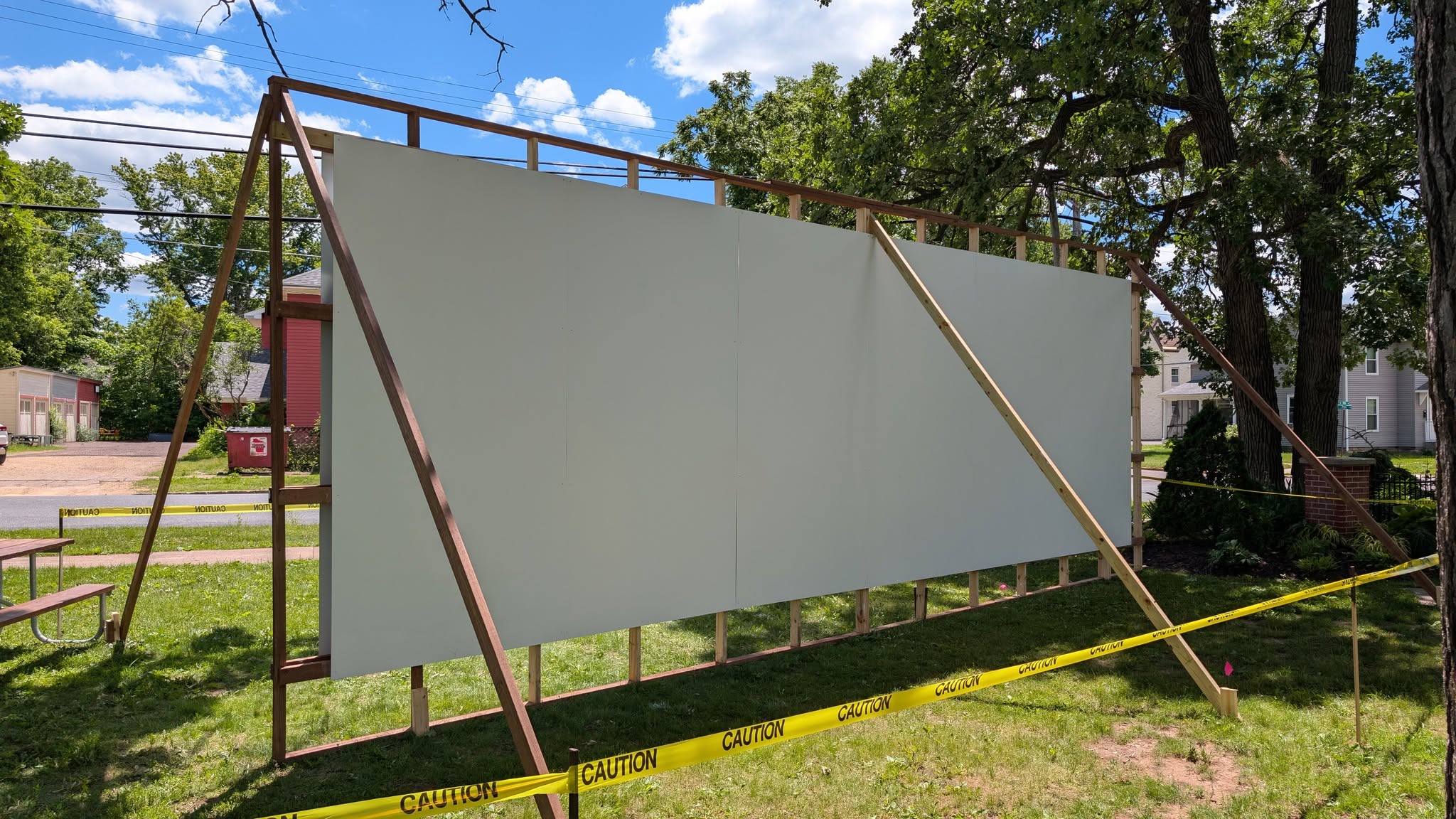 Wooden structure built to hold mural panels for painting