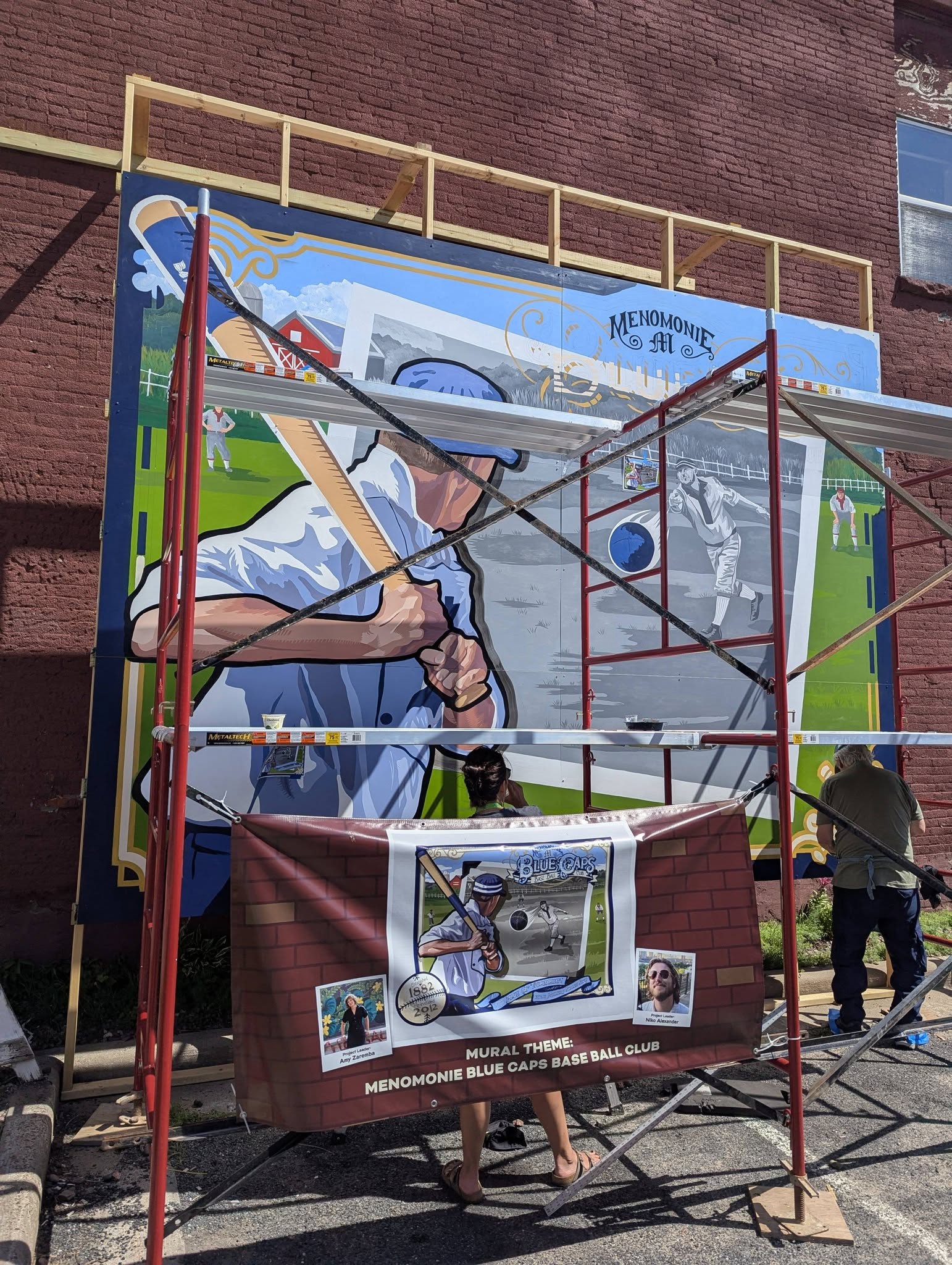 Scaffolding in front of the baseball mural