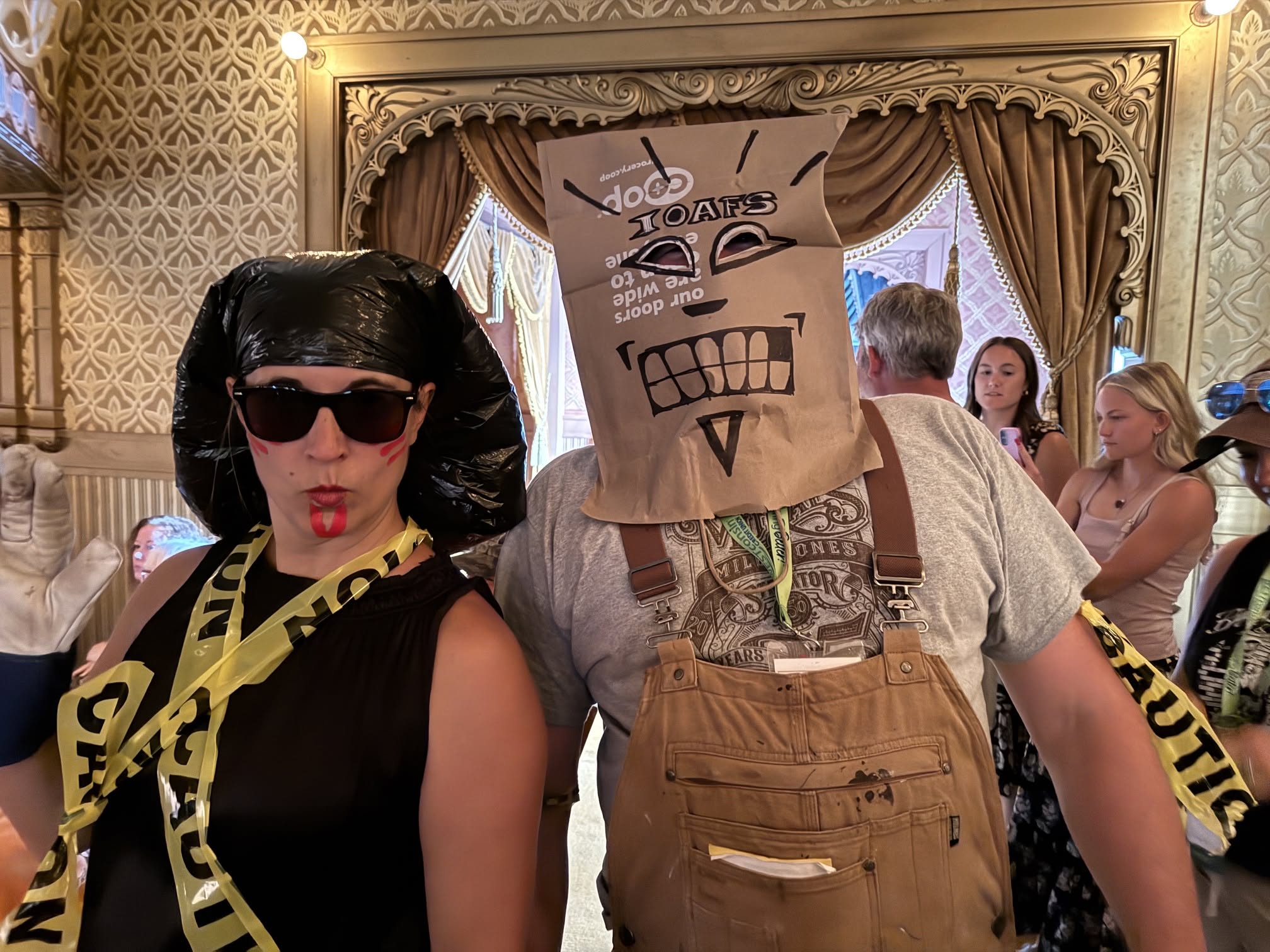 People in costumes with bags on their heads