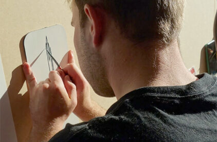 Man painting thin pinstripes